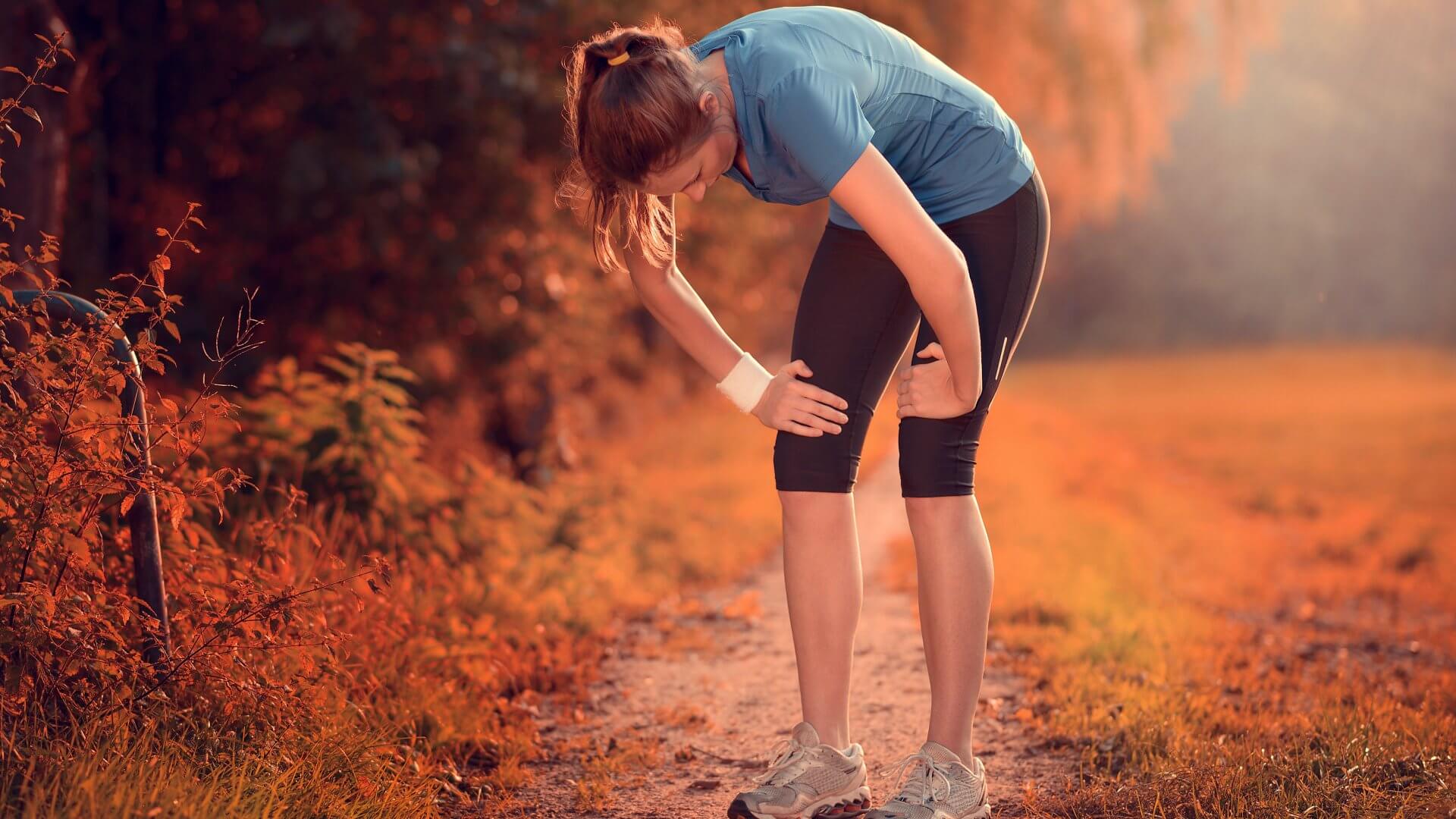 sports-recovery Young woman in sport recovery position